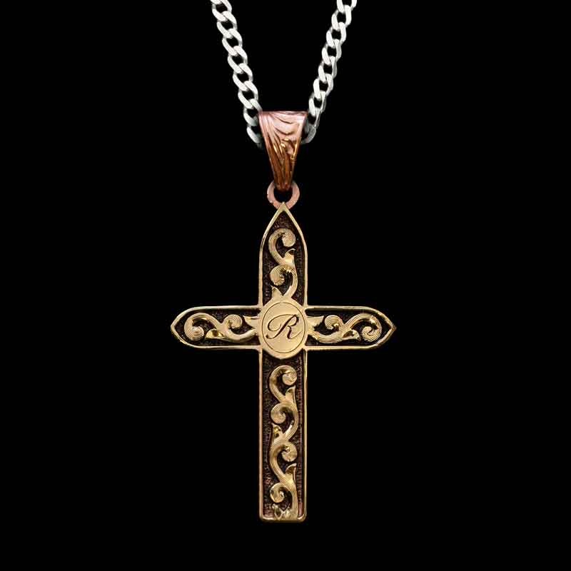 A cross pendant necklace with sterling silver chain