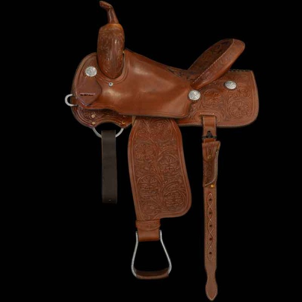 Adorned with a meticulously hand-carved half seat, this cutter saddle features a stunning blend of smooth and floral-carved rich brown leather. 