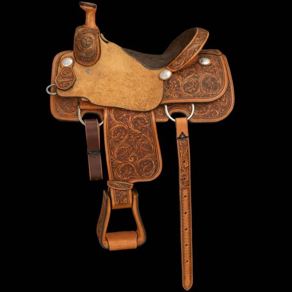 Featuring a padded textured leather half seat, roughout seat jockeys, and detailed floral carving and adorned with 6 engraved conchos. Customize this western roping saddle now!